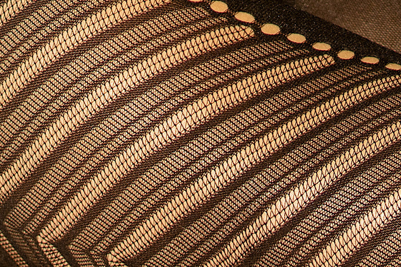 Close-up of black sheer diagonal stripe open-knit fabric on seamless crop top and leggings set