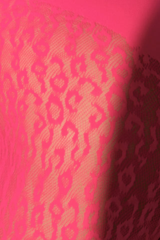 Close-up of hot pink sheer leopard pattern knit fabric on seamless crop top and leggings set